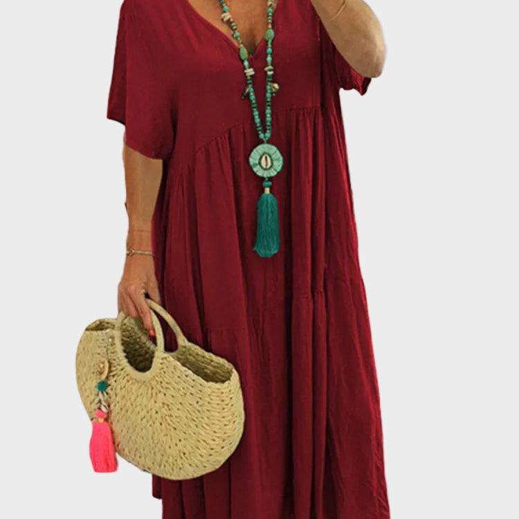 Linnea – Miękka maxi sukienka z falbanami i dekoltem w kształcie V